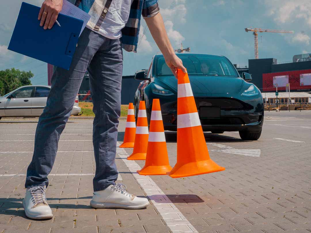 Great Lakes Academy Driving School Teacher putting out cones for parking practice in Sterling Heights, Michigan